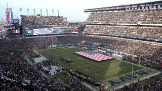 An American Flag is displayed on the field before a game between Army and Navy at Lincoln Financial Field in Philadelphia
