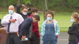 Perishioners wearing masks gather outside Solid Rock Baptists Church in Camden County, New Jersey.