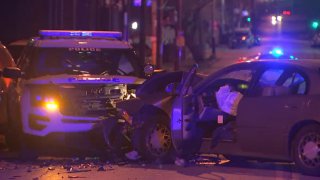 A Philadelphia police SUV and a sedan are totaled after a head-on crash in the city's Logan neighborhood.