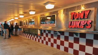 The pickup counter of a city cheesesteak shop