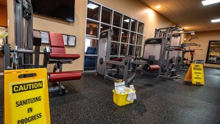 Large signs about sanitizing are posted around Golds Gym in East Northport, New York on Aug. 19, 2020, making sure everything is safe and operational for the reopening after the COVID-19 shutdown.