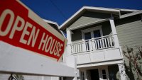 File Image: Open House signage is displayed outside of a home for sale in Redondo Beach, California, U.S., on Saturday, Feb. 14, 2015.