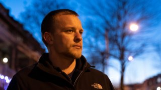 Andrei Doroshin, CEO of embattled company Philly Fighting COVID, looks on at the distance at dusk.