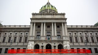 Orange barricades are erected outside of the Pennsylvania