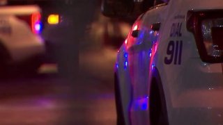 Side of a Philadelphia police car at night