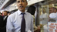 US Democratic presidential candidate US Senator Barack Obama and his wife Michelle pay a visit to Pat's King of Steaks to eat a cheesesteak in Philadelphia, Pennsylvania, on April 22, 2008. Pennsylvania holds its primary vote on April 22. AFP PHOTO/Emmanuel Dunand (Photo credit should read EMMANUEL DUNAND/AFP via Getty Images)