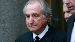 Bernard Madoff exits federal court March 10, 2009, in New York City. Madoff, a financier most known for heading the biggest Ponzi scheme in history, has died in prison at the age of 82.