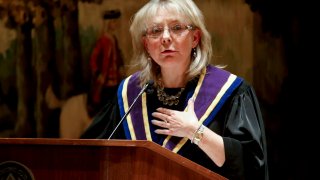 In this Jan. 8, 2016 file photo, Pennsylvania Supreme Court Justice Christine Donohue addresses those gathered at her swearing in ceremony in Pittsburgh.