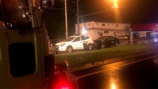 A crime scene with two cars and a stroller