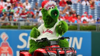 The Phillie Phanatic Points while riding his SUV