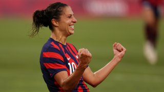 Carli Lloyd clinches fists in celebration