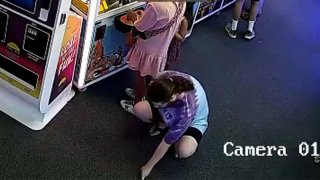 A man squats down behind a woman and slides his phone underneath her dress. Police in Cape May, New Jersey, say he targeted women in the same fashion at two arcades.