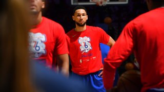 Ben Simmons in a red Sixers' warmup t-shirt
