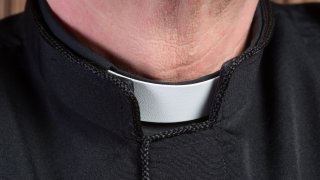 A close up of a priests collar