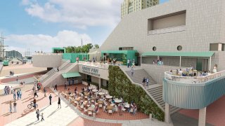 A rendering of the completed Liberty Point restaurant shows people milling about on the ground and on a balcony overhead.