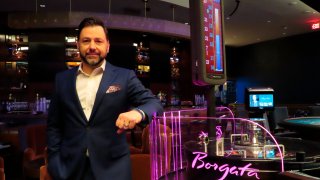 Travis Lunn, the new president of Atlantic City, N.J.'s Borgata casino poses for a photo near a roulette table on Feb. 17, 2022
