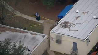 Police tape blocks off part of a schoolyard