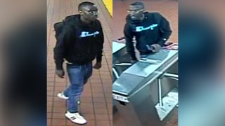 Man wearing glasses, black hoodie, blue jeans and white sneakers walks through a turnstile