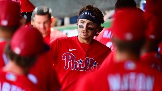 Bryson Stott high fives Phillies teammates