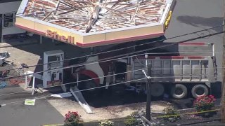 Dump truck crashed into a Shell gas station.