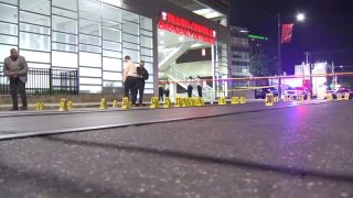 Police markers and investigators outside Temple University Hospital.