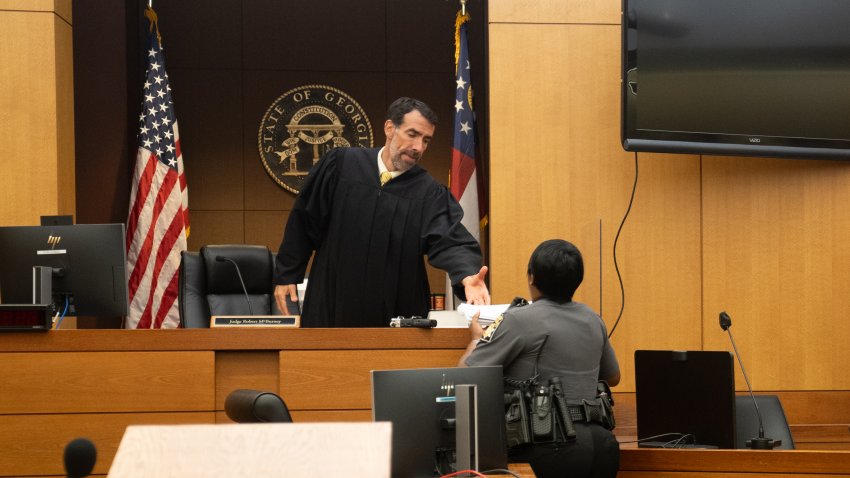 ATLANTA, GEORGIA – AUGUST 14: Fulton County Superior Court Judge Robert McBurney receives documents on August 14, 2023 in Atlanta, Georgia. District Attorney Fani Willis has been bringing evidence before a grand jury, which today indicted former President Trump on alleged attempts to overturn the 2020 election results in the state. (Photo by Megan Varner/Getty Images)