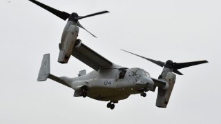 This photograph taken on April 18, 2016 shows a US Marine tilt-rotor Osprey aircraft landing at an emergency helicopter landing site in Minami-Aso, Kumamoto prefecture.