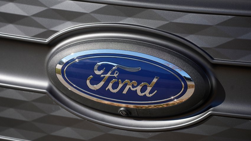 FILE - The Ford company logo is shown on Nov. 25, 2022, outside a Ford dealership in southeast Denver.