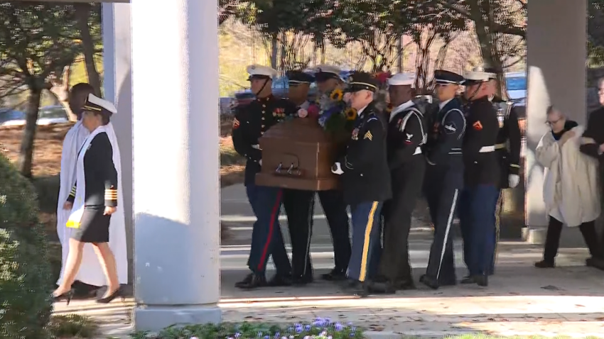 Rosalynn Carter's casket being held by members of the military on her way to the Jimmy Carter Presidential Library and Museum