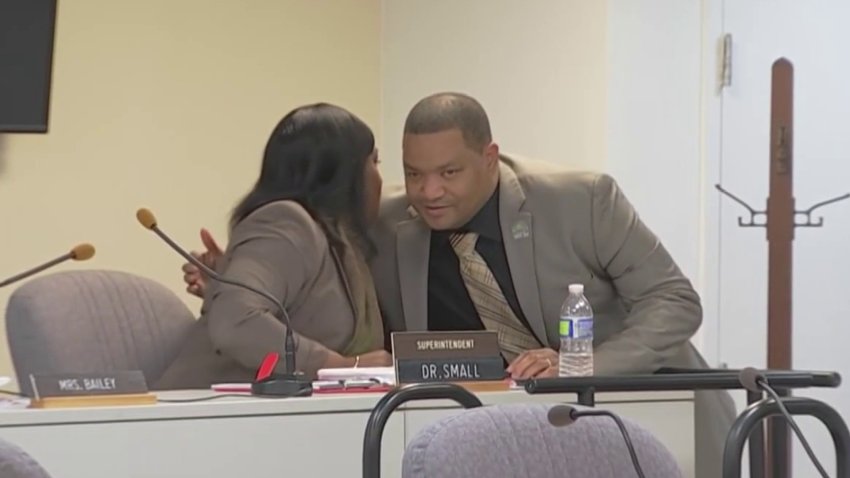 Atlantic City Schools Superintendent LaQuetta Small, whispers to her husband, Mayor Marty Small, during a board meeting on Tuesday night.