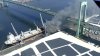 Densa nube de humo por fuego en el puerto provoca congestión en puente Walt Whitman
