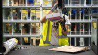 A worker prepares an Apple iPad package at an Amazon same-day delivery fulfillment center on Prime Day in the Bronx borough of New York, US, on Tuesday, July 16, 2024. Amazon.com Inc.’s Prime Day sales rose about 13% in the first six hours of the event compared with the same period last year, according to Momentum Commerce, which manages 50 brands in a variety of product categories. Photographer: Stephanie Keith/Bloomberg via Getty Images