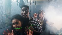 young adults having fun in a halloween haunted house.