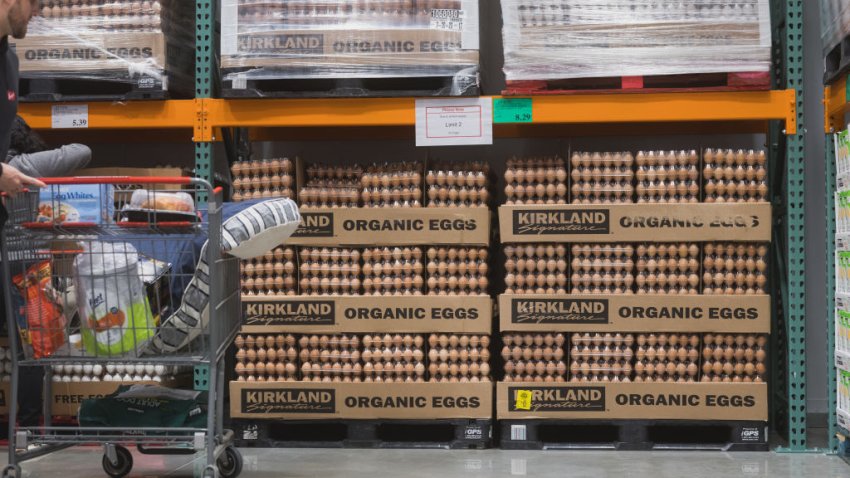 A shopper picks up eggs during the grand opening of a Costco Wholesale store in Kyle, Texas, US, on Thursday, March 30, 2023. The new wholesale store is around 160,000 square feet, and the gas station is outfitted with 24 pumps. Photographer: Jordan Vonderhaar/Bloomberg via Getty Images