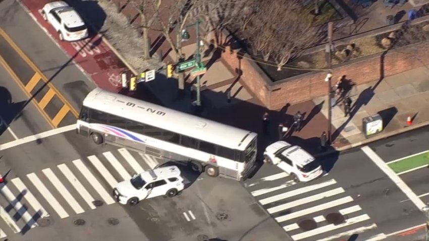 An NJ Transit bus remains on the scene after a child was struck at the intersection of 6th and Market streets on Monday, Dec. 30, 2024.