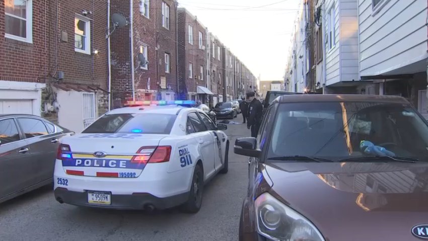 Police car parked behind Rorer Street homes