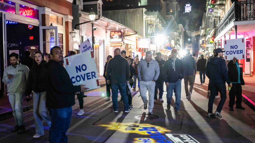 TOPSHOT – People walk past bars on Bourbon Street after it reopened to the public on January 2, 2025, in New Orleans, Louisiana, following an attack on January 1 which left 14 dead. A US army veteran loyal to the Islamic State jihadist group likely acted alone when he killed 14 and injured dozens in a truck attack on a crowd of New Year revelers in New Orleans, the FBI said on January 2. (Photo by ANDREW CABALLERO-REYNOLDS / AFP) (Photo by ANDREW CABALLERO-REYNOLDS/AFP via Getty Images)