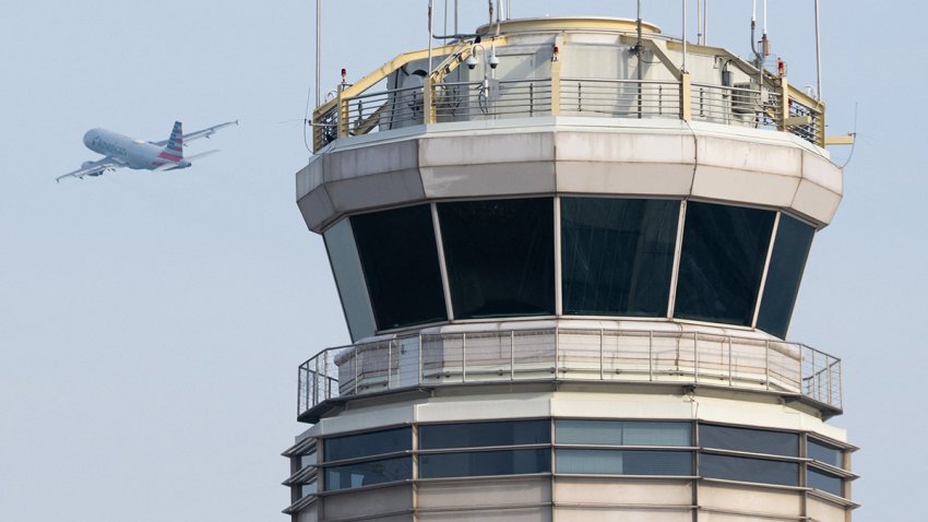 An American Airlines Airbus A319 airplane takes off past the air traffic control tower at Ronald Reagan Washington National Airport in Arlington, Virginia, January 11, 2023. The US Federal Aviation Authority  said Wednesday that normal flight operations “are resuming gradually” across the country following an overnight systems outage that grounded departures. (Photo by SAUL LOEB / AFP) (Photo by SAUL LOEB/AFP via Getty Images)