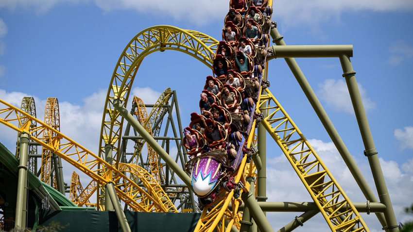 Guests ride the Stardust Racers rollercoaster in the Celestial Park area, at the Epic Universe theme park in Orlando, Florida, US, on Saturday, April 5, 2025. Epic Universe, the $7 billion attraction from Comcast Corp.’s Universal Destinations & Experiences division, offers five distinct lands and opens to the public on May 22. Photographer: Thomas Simonetti/Bloomberg via Getty Images