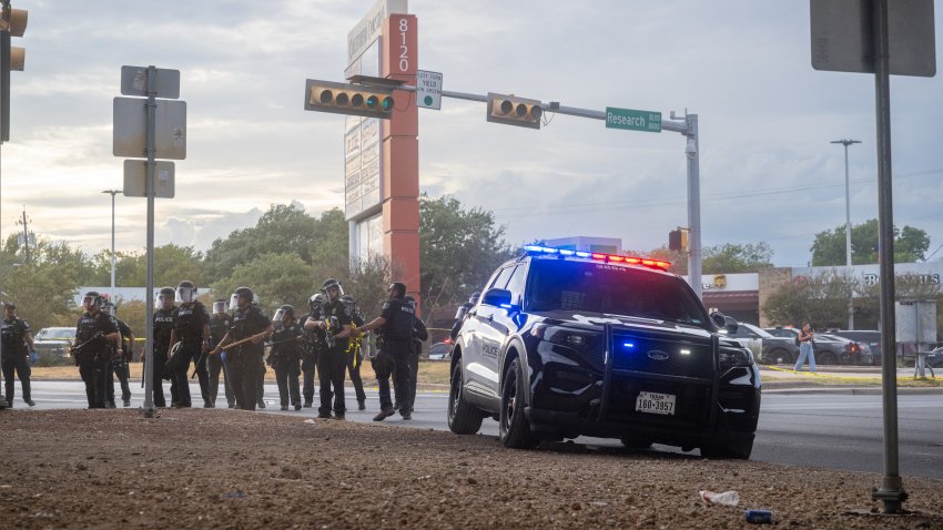 AUSTIN, TEXAS – SEPTEMBER 20: Law enforcement retreat as people protest against Immigration and Customs Enforcement officers on September 20, 2026 in Austin, Texas. A federal ICE officer shot and wounded a person earlier this afternoon in North Austin.  (Photo by Brandon Bell/Getty Images)