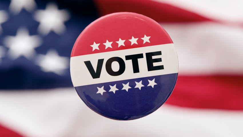 USA, New York, New York City, Vote Badge against American flag